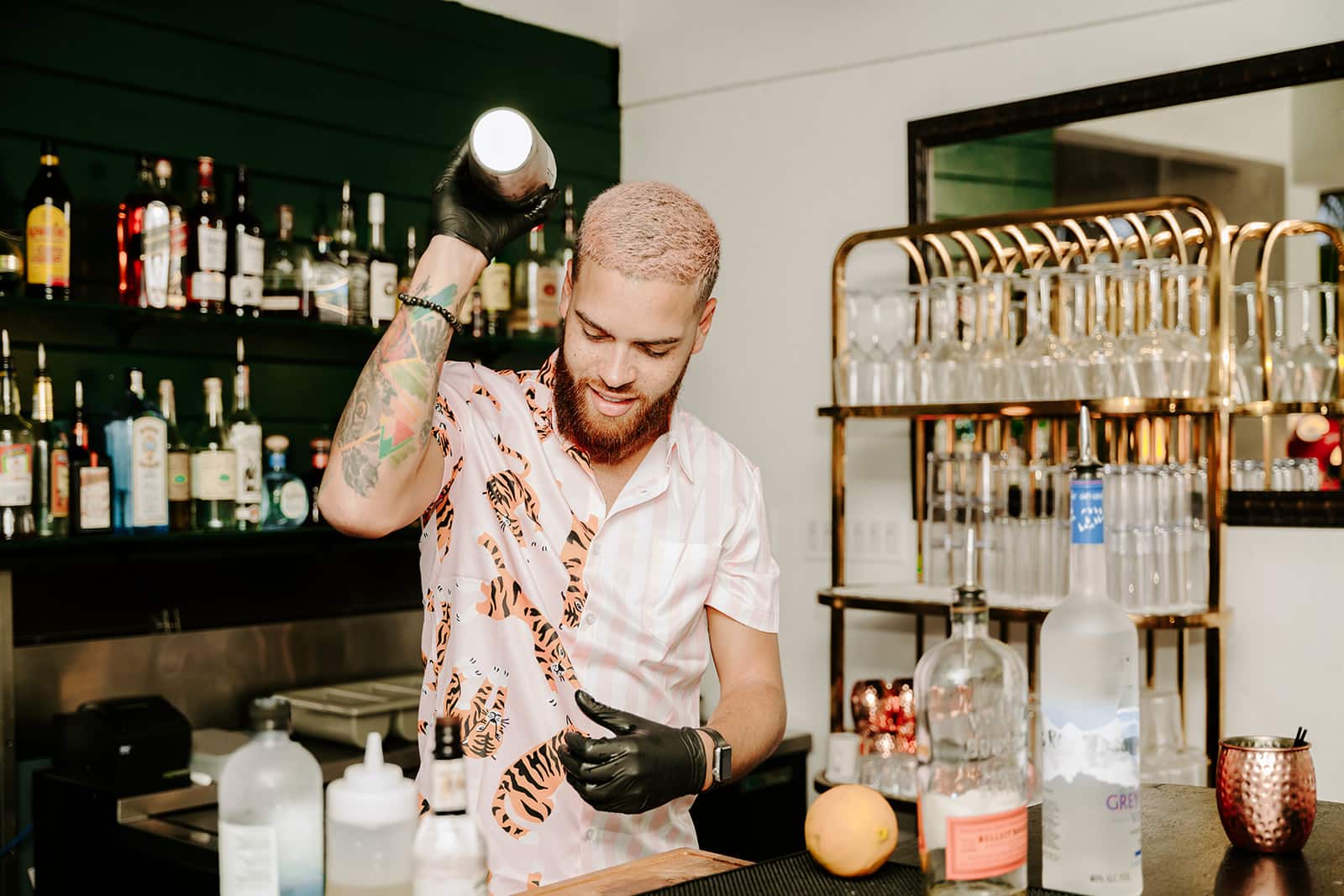 The Pink Palm Hotel - Bartender makes cocktails